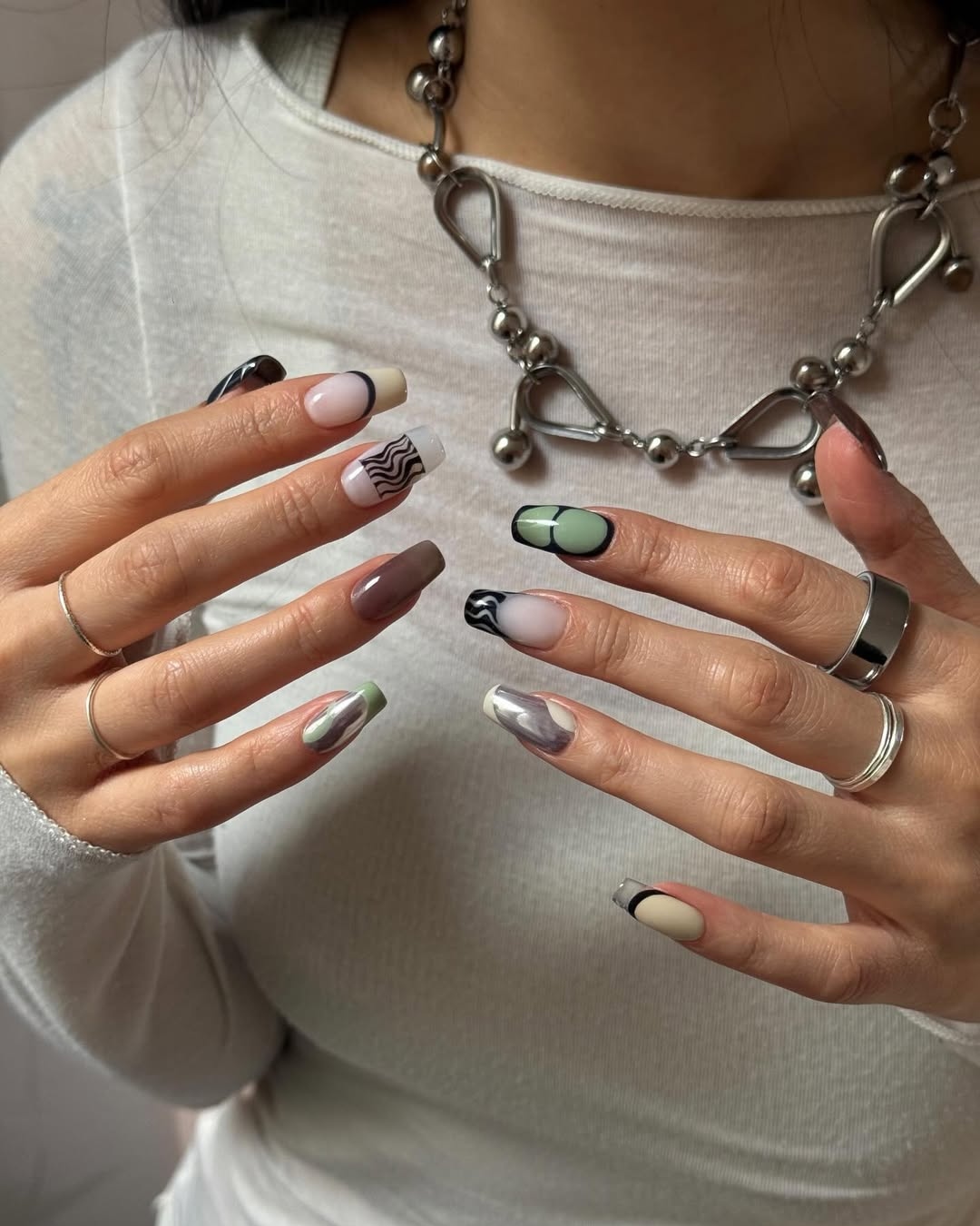 A squared, "soft chaos" manicure by Oksana Zavora