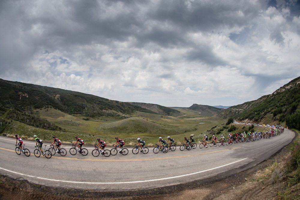 The peloton gets strung out on the way up the KOM