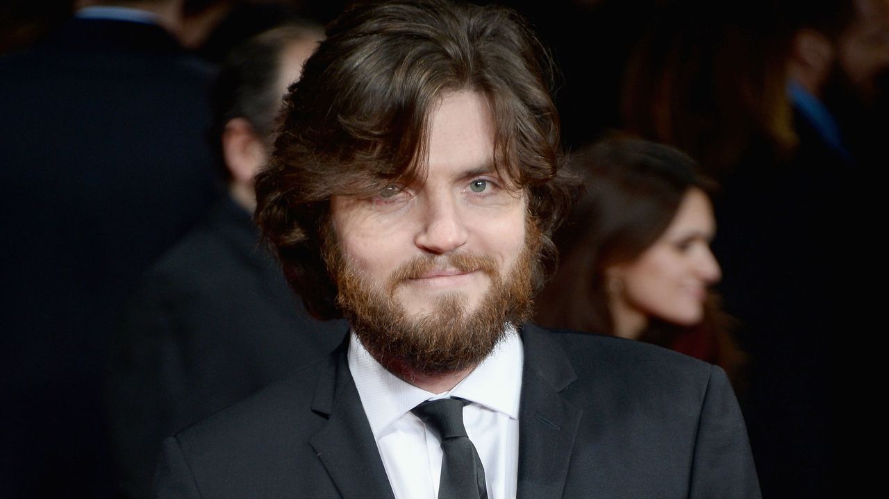 Actor Tom Burke attends premiere in London. 