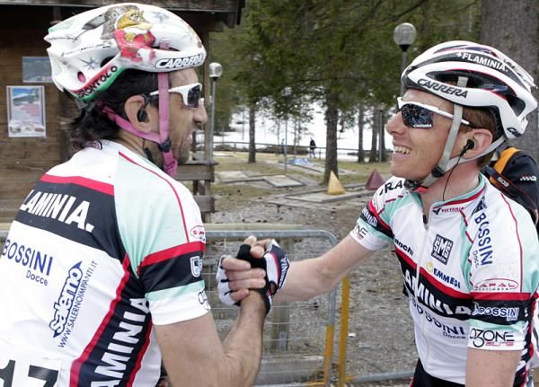 Andrea Noe, left, congratulates teammate Riccardo Ricco' for his stage win.