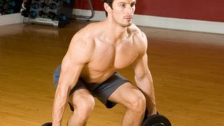 Squat to curl to press: Step 1