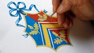 A view of someone painting the Middleton Coat of Arms