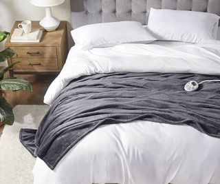 Serta Electric Blanket on a bed with white sheets.