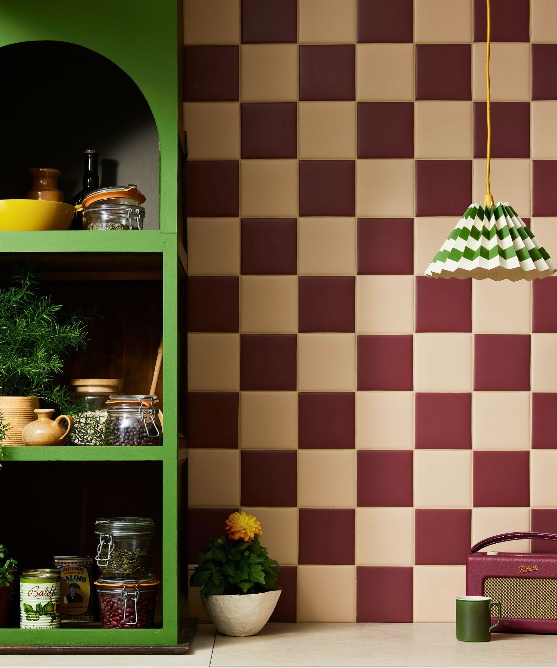 A cream and burgundy kitchen backsplash