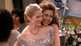 Carol (Jane Sibbett) and Susan (Jessica Hecht) hug at the their wedding reception on Friends Season 2 episode The One with the Lesbian Wedding.