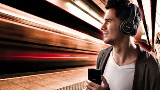 Sony MDR-1AM2 Headphones worn by a man in a subway station