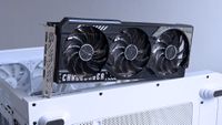 ASRock Challenger Radeon RX 9070 XT GPU on top of an iBUYPOWER RDY Trace X R01 pre-built gaming PC in a white case