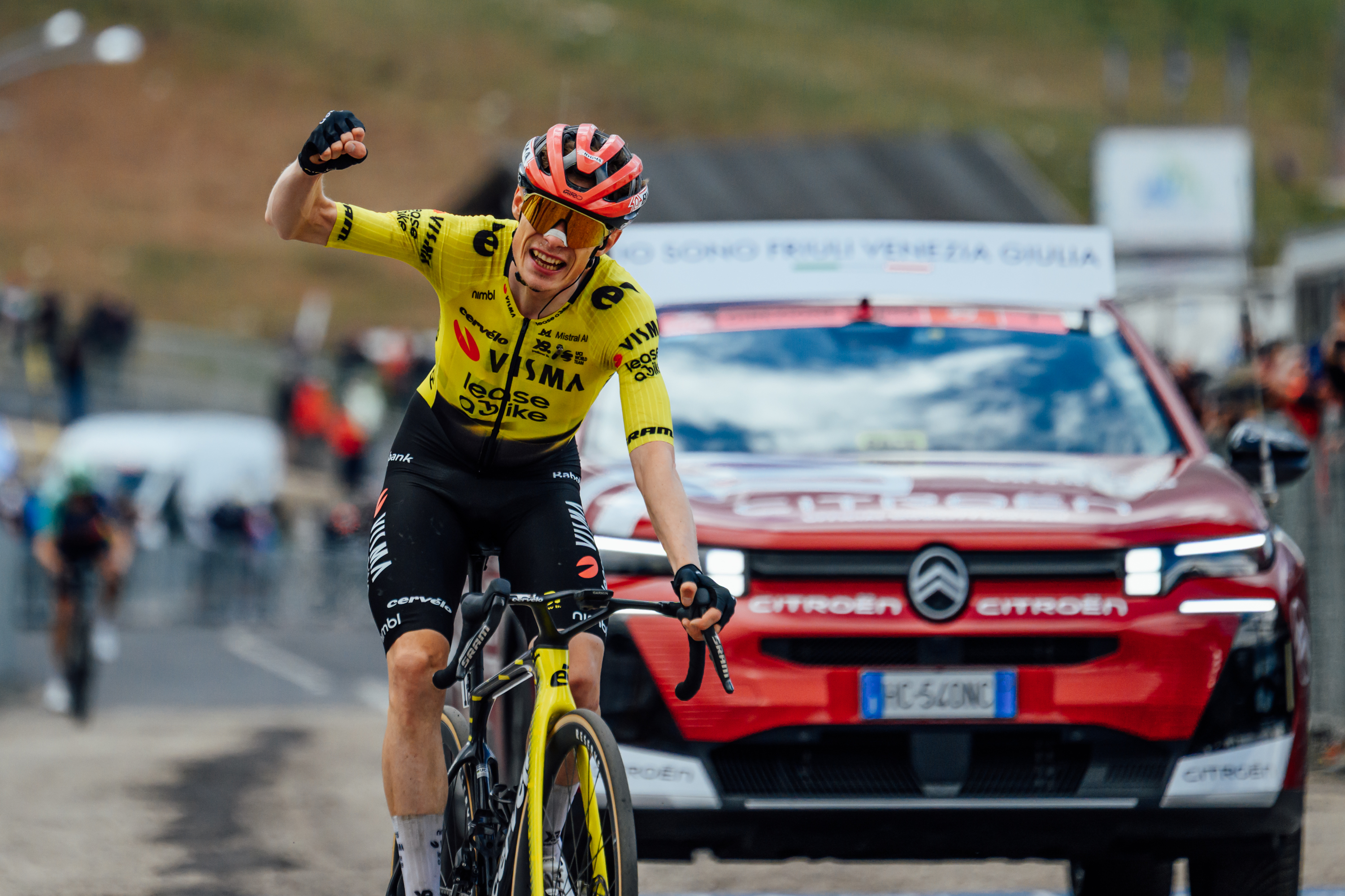 Jonas Vingegaard punches the air after taking the victory on Blockhaus.. Images from 2026 Giro d'Italia stage 7 to Blockhaus