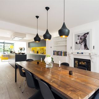 living room with white walls and dinning table with chairs