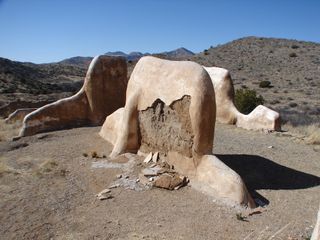 Today the old adobe walls of the second Fort Bowie site lie in ruin on the mountain's saddle. These remaining ruins are encased in protective limestone casings.
