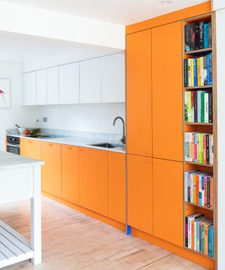an orange kitchen from the Honest range at Sustainable Kitchens