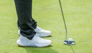 The Under Armour Phantom Golf Shoe line up a putt