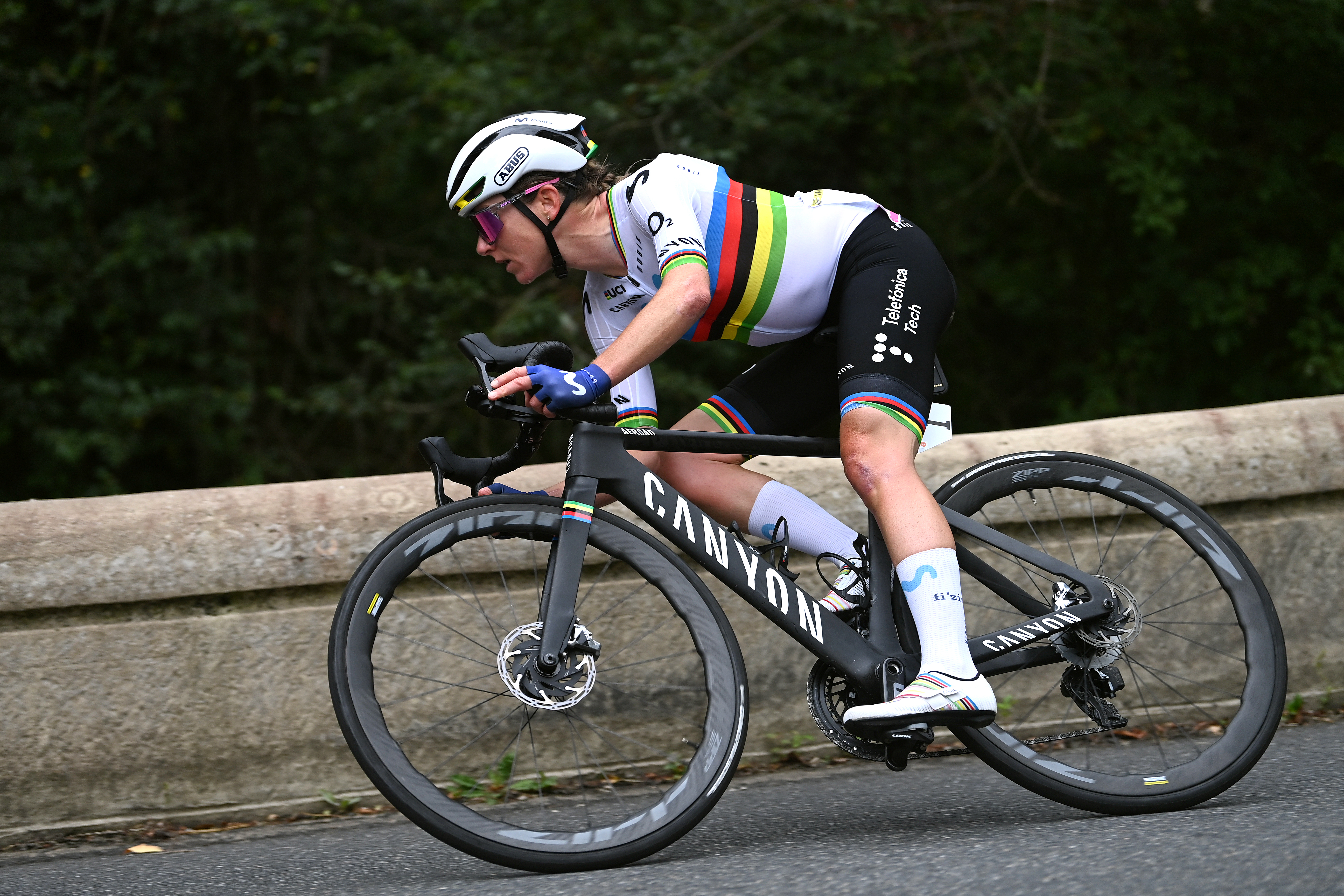 Annamiek van Vlueten racing in the rainbow jersey as world champion in a cyclo cross race