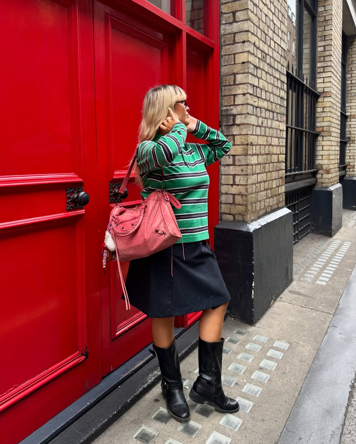 @gracealexandriaa wearing a chic spring boot and skirt outfit
