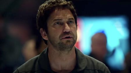 Gerard Butler looking concerned in Geostorm