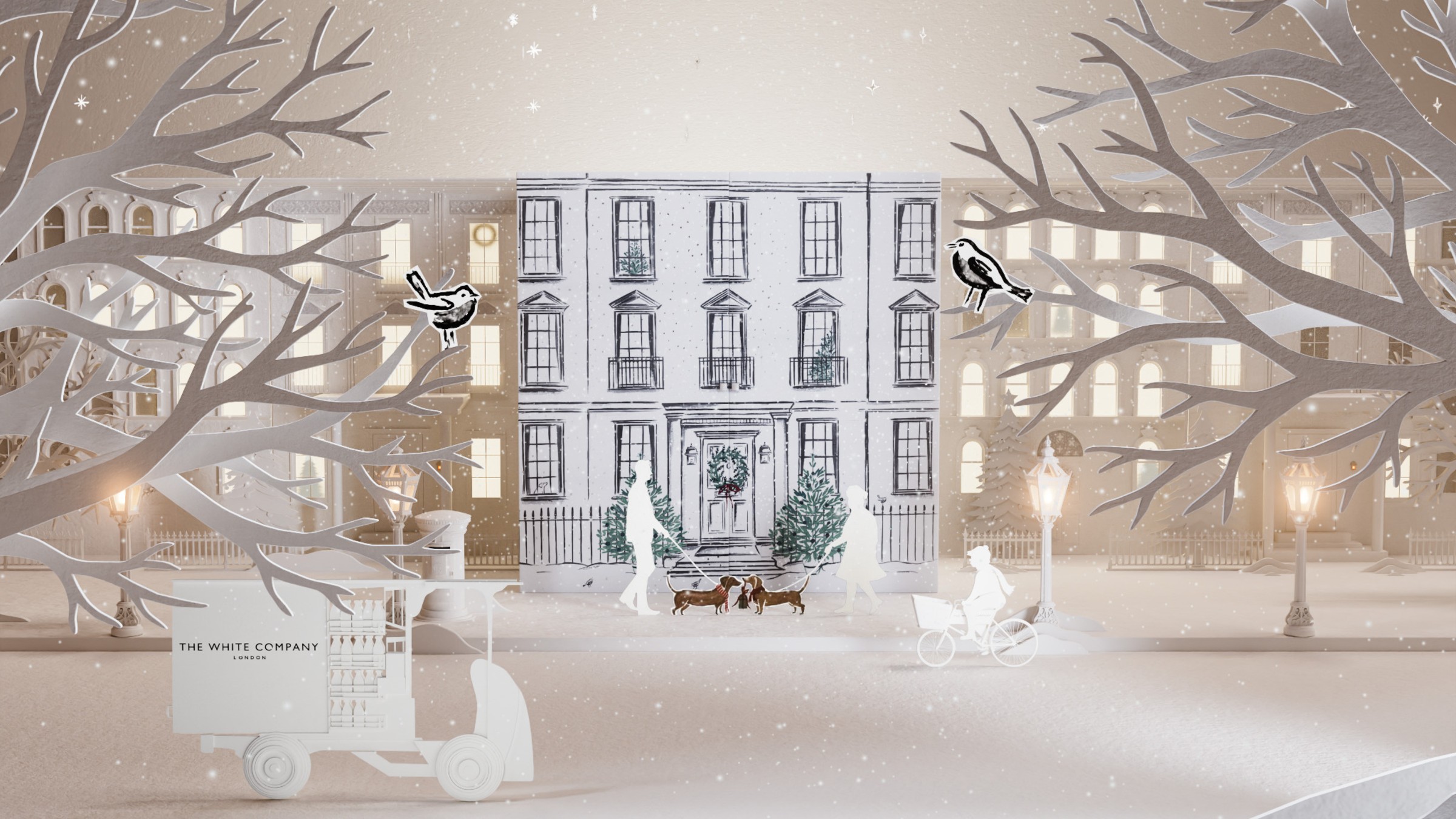 The White Company advent calendar 2026 closed covered with a hand-drawn design and paper cut-out props arranged around it