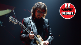 Tony Iommi playing guitar on stage