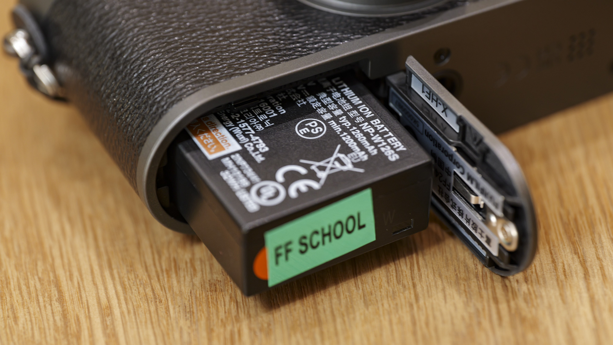 Close up of Fujifilm X half compact camera's battery