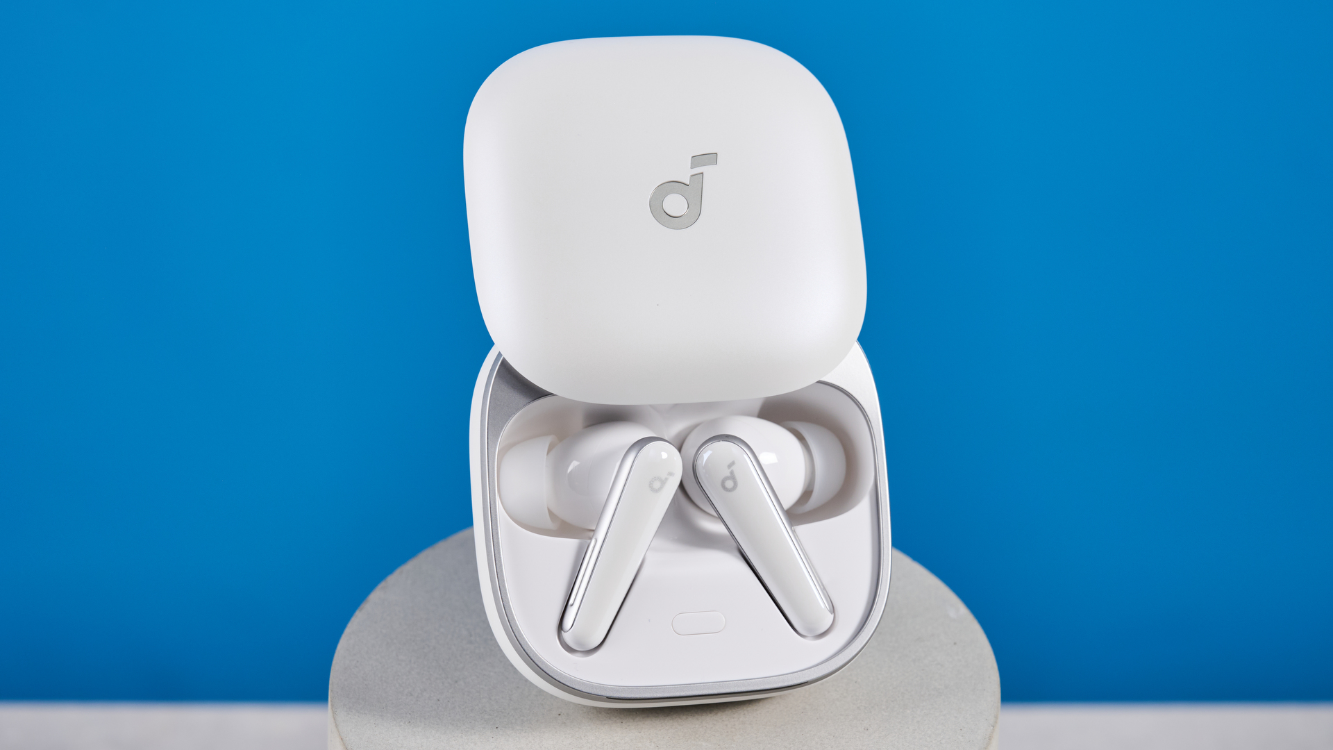 The Soundcore Liberty 5 photographed in front of a blue background.