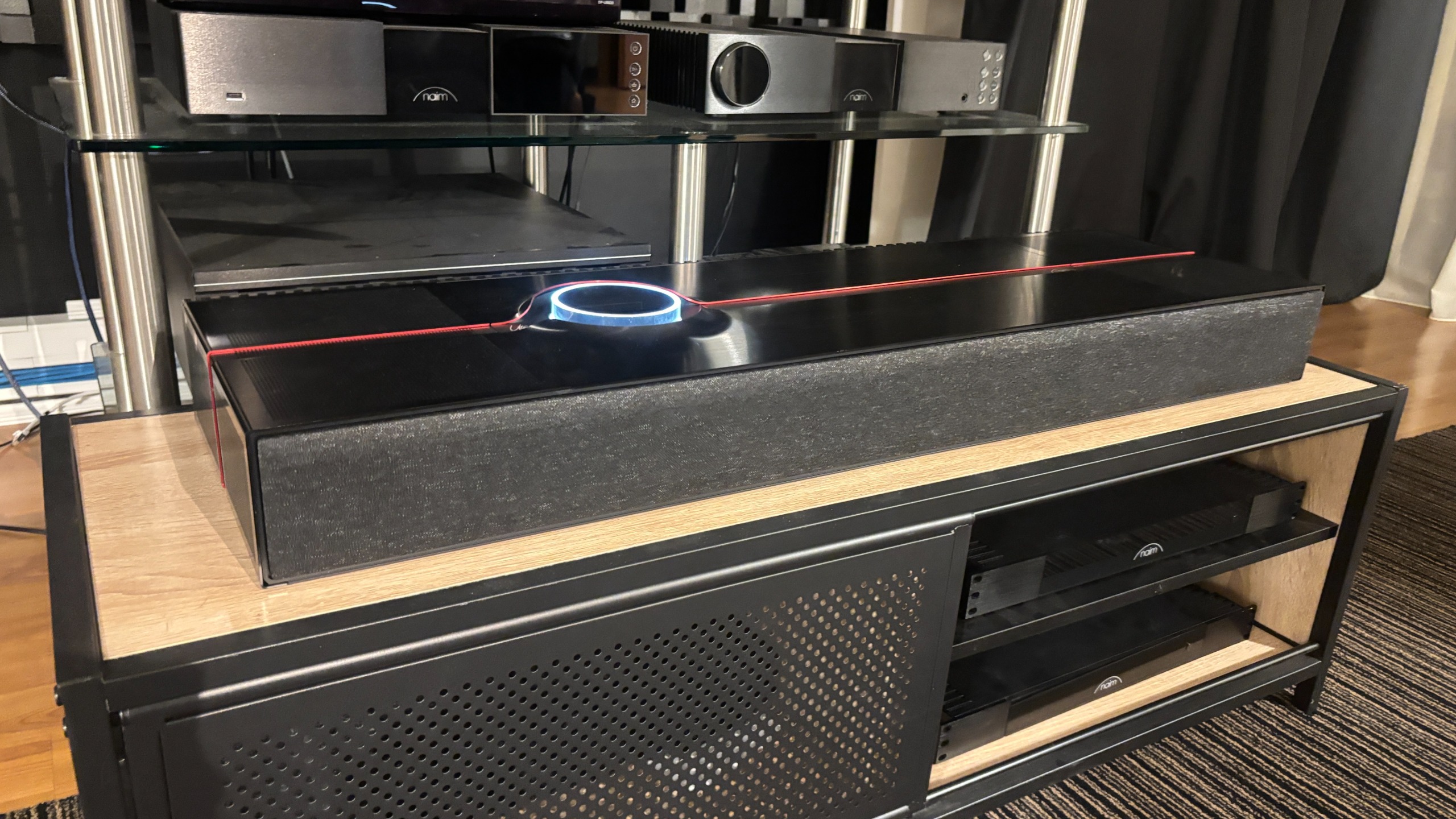 Naim Mu-so Utopia all-in-one system in black in a demo room 