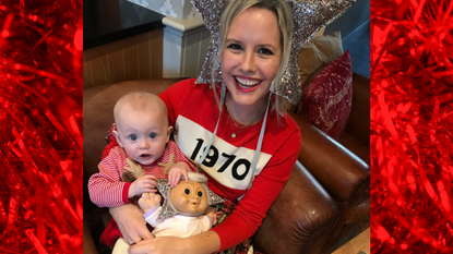 Alex Stedman with baby dressed in star headgear for christmas