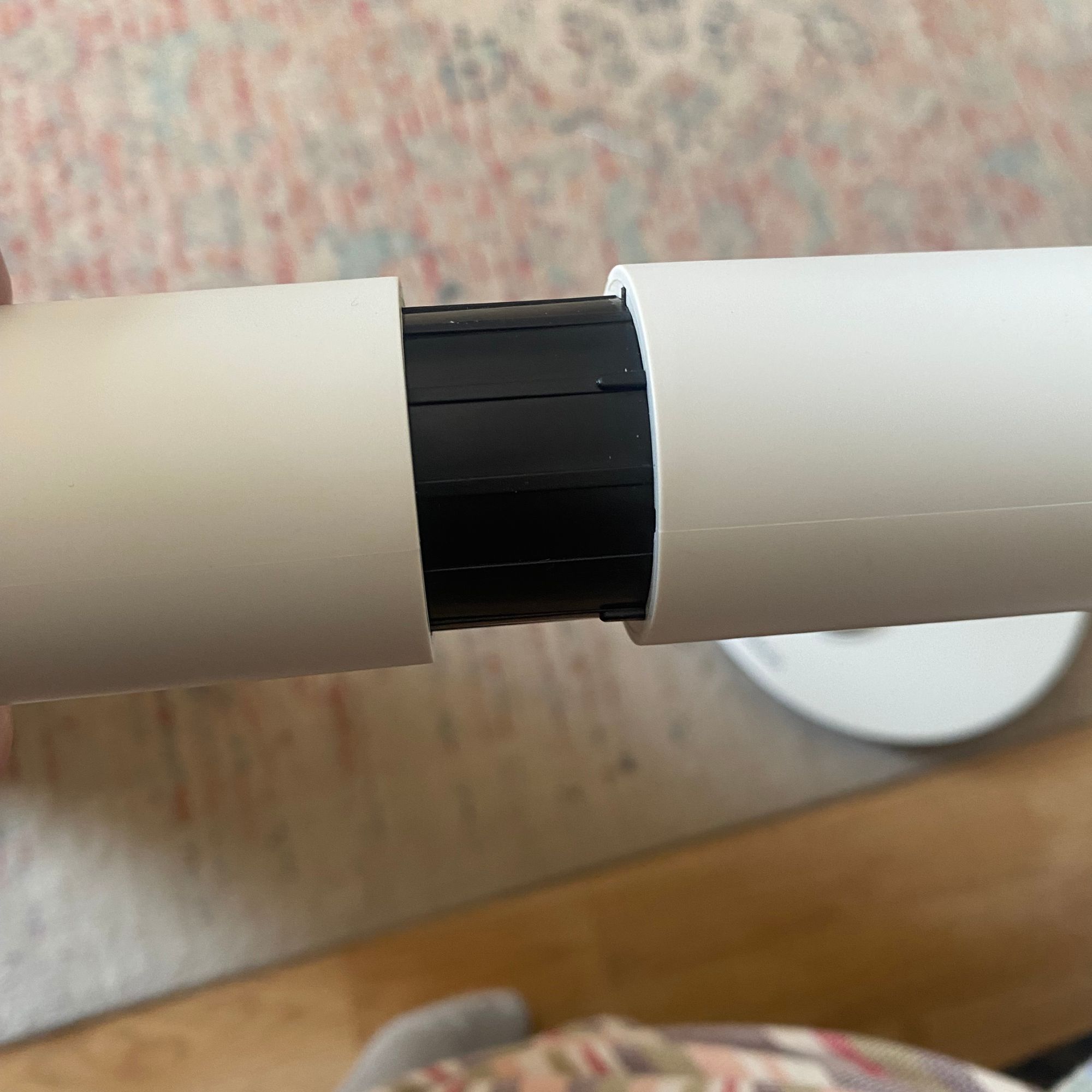 Close up of the Duux Whisper Flex 2 fan stem being assembled