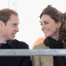 Kate Middleton and Prince William smiling at each other in 2011