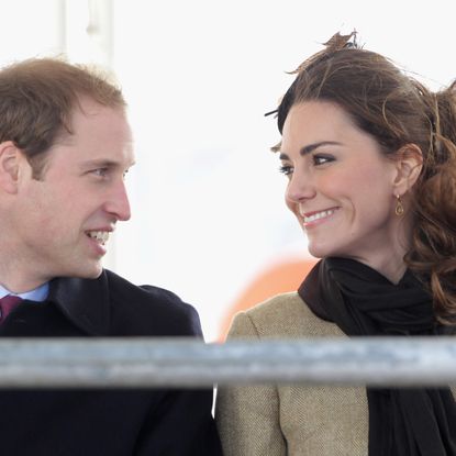 Kate Middleton and Prince William smiling at each other in 2011