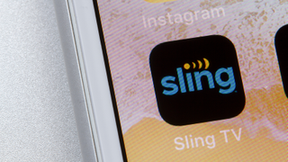 Sling TV mobile app icon is seen on an iPhone. 