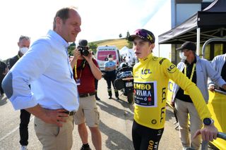 Christian Prudhomme in converation with Jonas Vingegaard at the 2023 Tour de France.