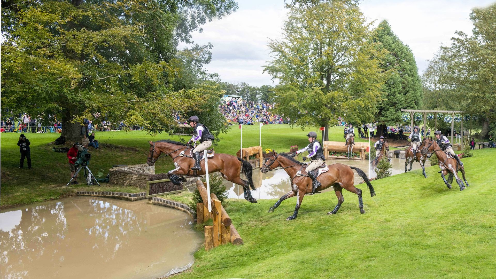 Horse jumping into the trout hatchery at Burghley