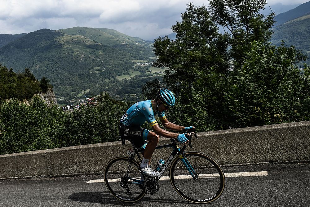 Tanel Kangert (R) and France's Nicolas Edet ride during a two-men breakaway in the first kilometers of the 17th stage