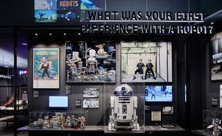 R2-D2 – are displayed around a darkened space