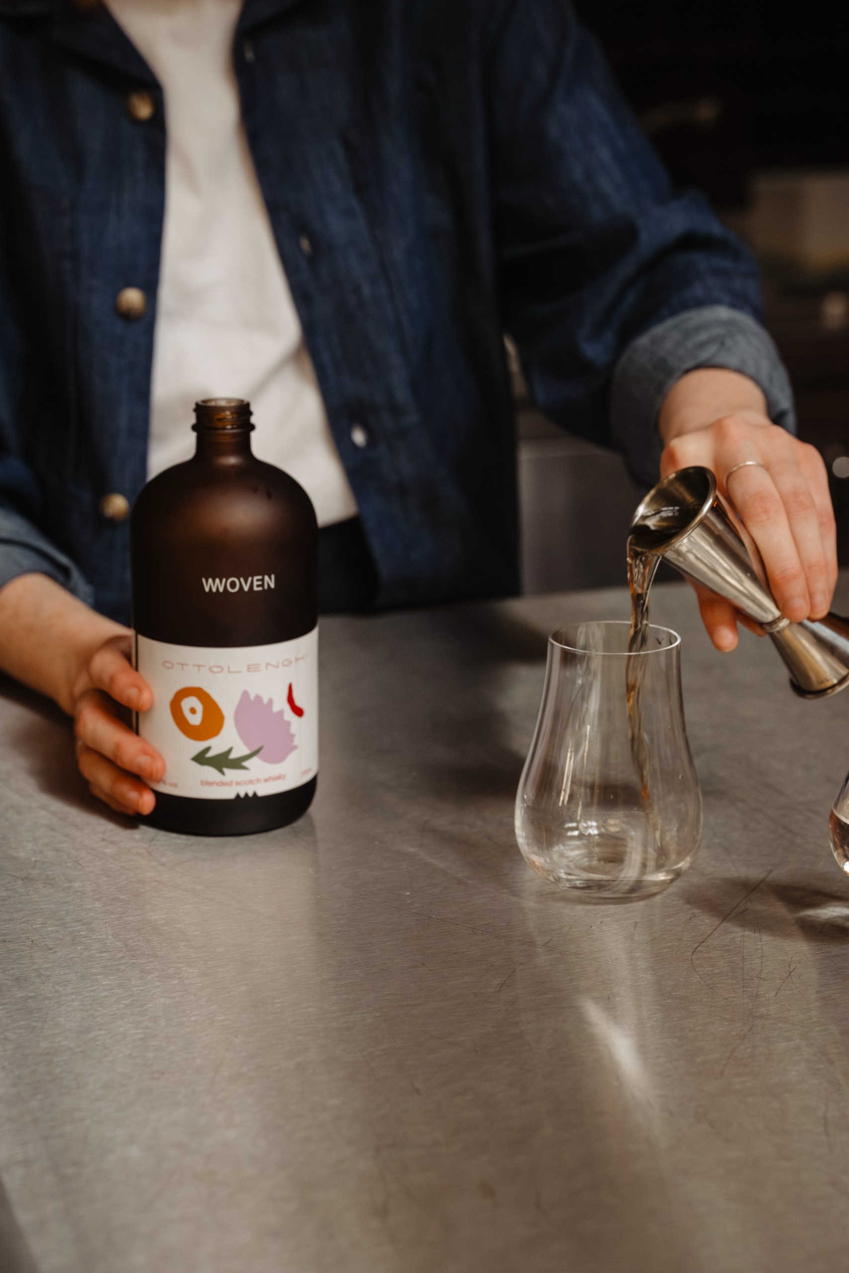 Pouring specially blended eau de vie at Ottolenghi Edinburgh restaurant