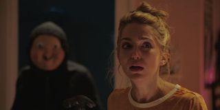 Killer sneaking up on victim in Happy Death Day