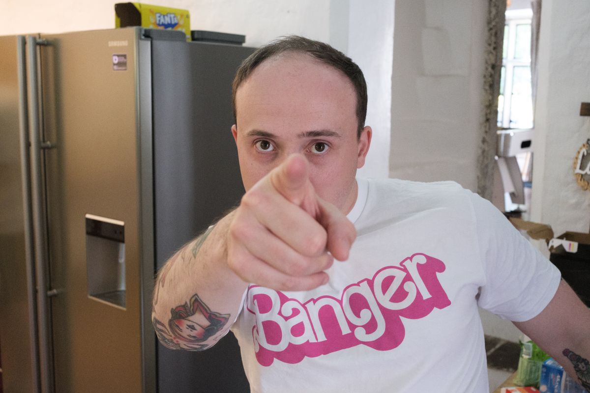 A photo of a man pointing at camera, taken on the Fujifilm X-E5.