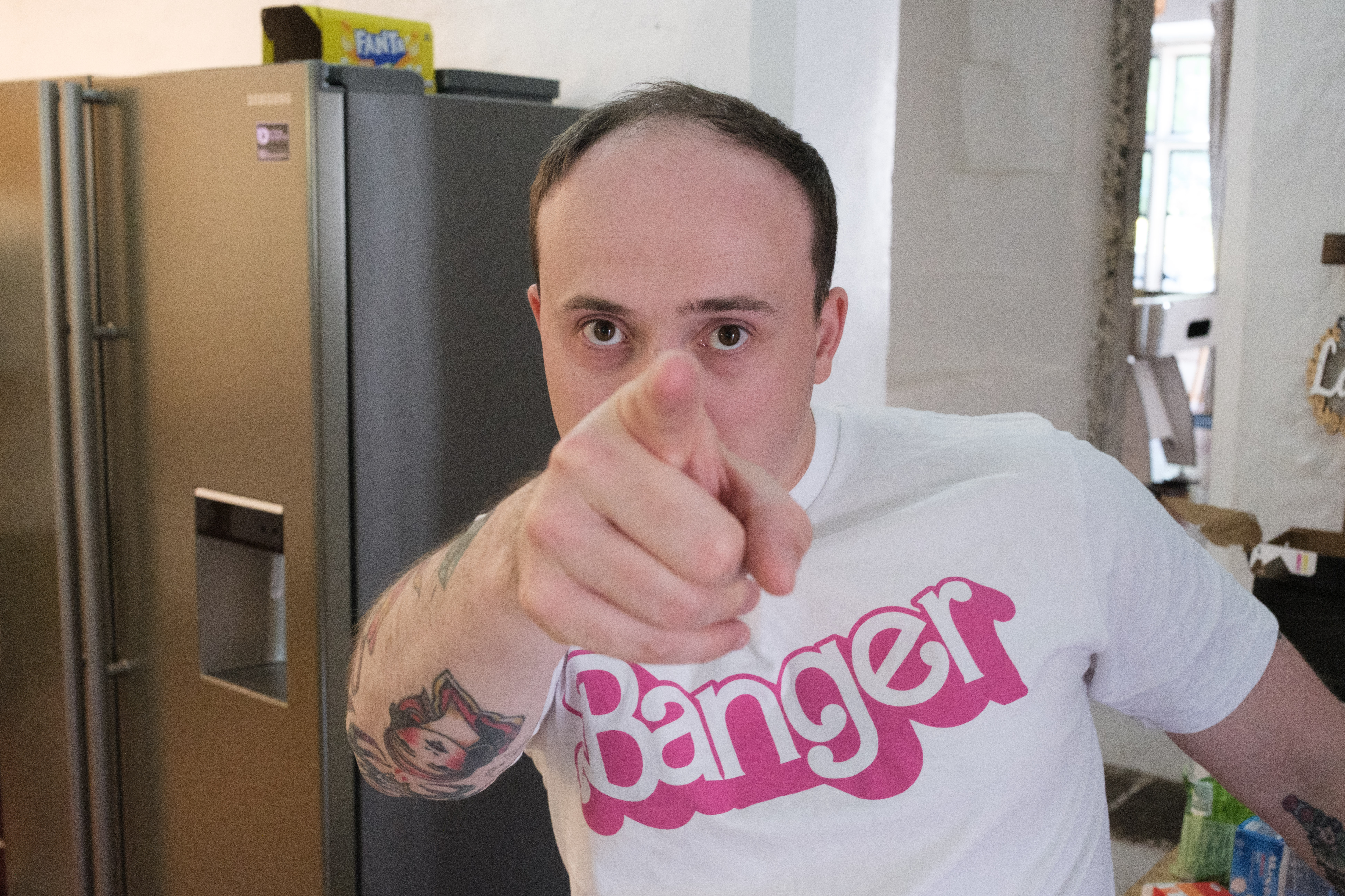 A photo of a man pointing at camera, taken on the Fujifilm X-E5.