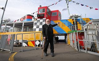 Sir Peter Blake welcoming travellers aboard the Razzle Dazzle Ferry