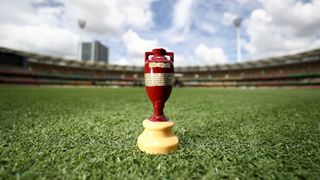 The Ashes trophy on a cricket pitch