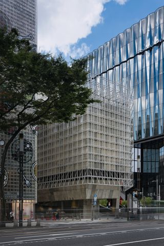 Sony Park Ginza and its brutalist volume, with meshed exterior and concrete interior