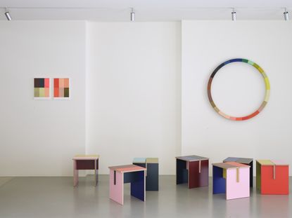 Tables made of colourful plywood sections intersected, made by Sophie Smallhorn for Uncommon projects
