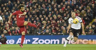 Mohamed Salah of Liverpool scores the fourth goal making the score during the Premier League match between Liverpool FC and Manchester United at Anfield on March 05, 2023 in Liverpool, England.