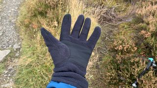 A hiker's hand wearing the Columbia Fast Trek III Fleece Gloves, palm up