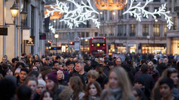 LONDON, ENGLAND - DECEMBER 14: Hordes of Christmas shoppers walk beneath festive lights on Regent Street on December 14, 2013 in London, England. As Christmas Day approaches, London&amp;#039;s central