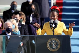 Amanda Gorman giving speech at Joe Biden's inauguration ceremony