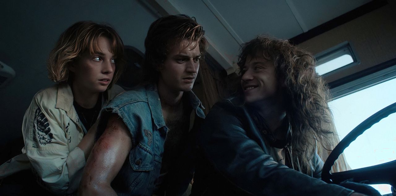 Natalia Dyer (as Nancy), Joe Keery (as Steve) and Joseph Quinn (as Eddie Munson) in a press image for Stranger Things 4