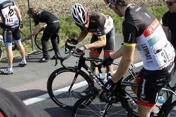 Fabian Cancellara (RadioShack-Nissan) checks over his bike following a crash.