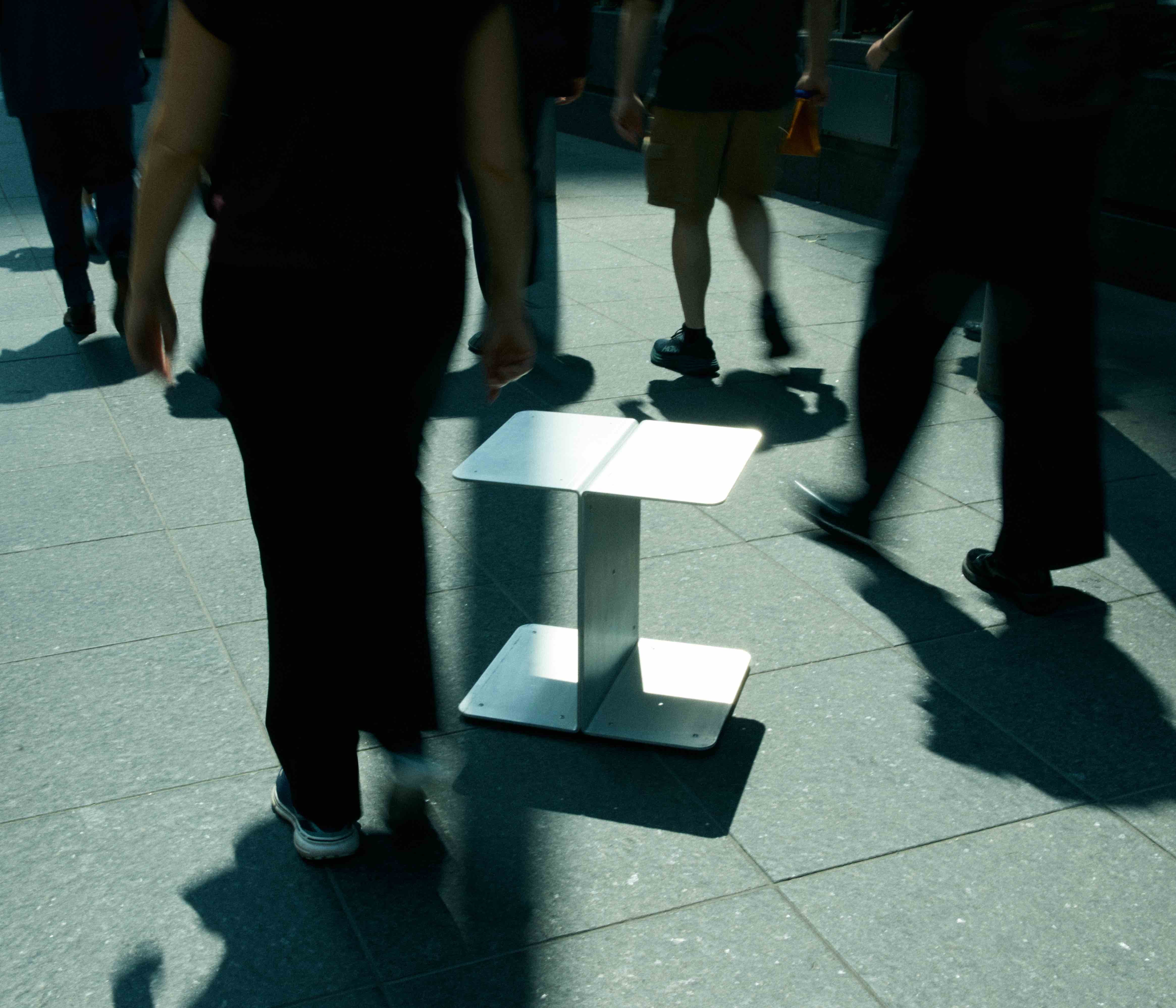 aluminium side table on pavement