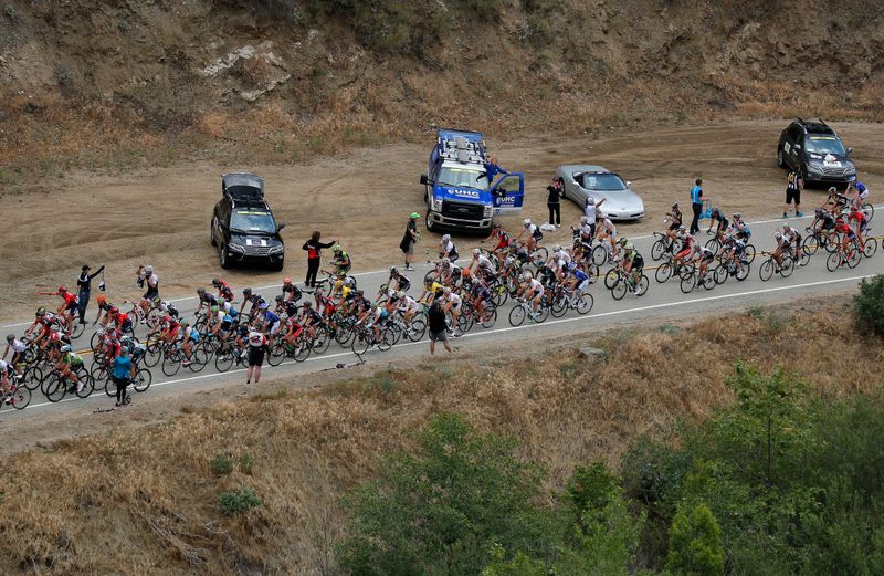 The peloton passes through the feedzone