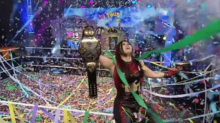 Iyo Sky celebrating her NXT Women's Championship victory